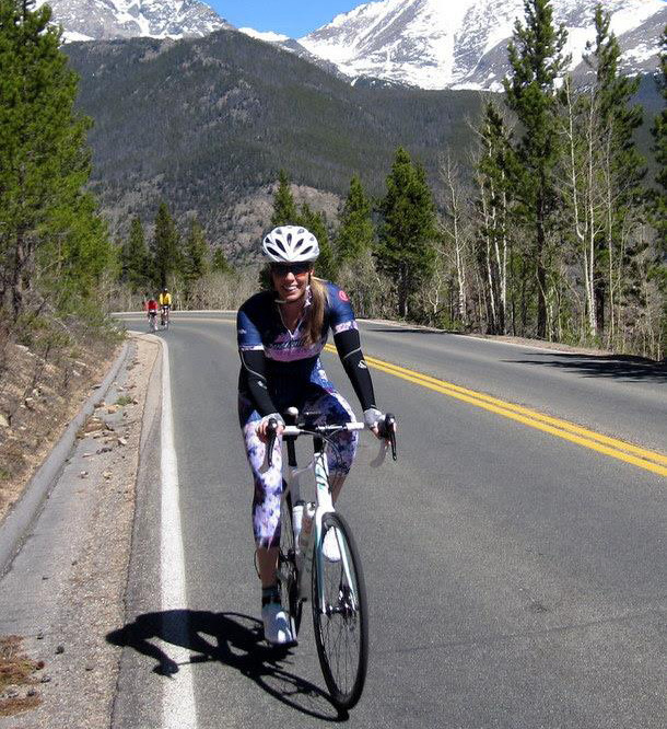 Dr. Tracey Hughes riding her bike
